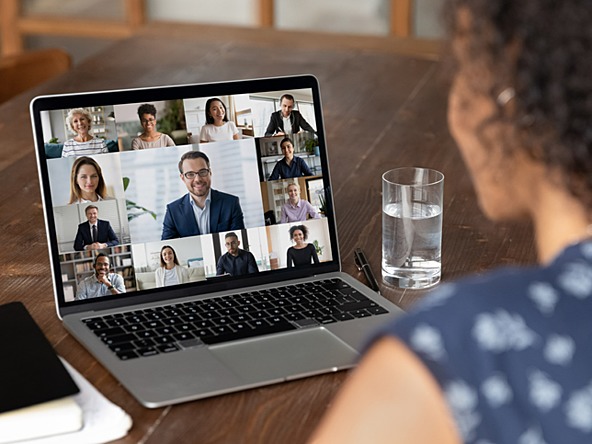 Woman taking part in online event on laptop